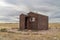 Old, metal, rusty shack on a prairie