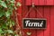 Old metal sign with the inscription Closed in french - Ferm