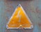 an old metal triangular yellow Portuguese electricity safety sign with a lightning bold symbol reading perigo de morte -