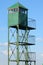 Old metal watchtower against blue sky