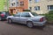 Old metalic grey big luxury sedan Volvo S90 parked