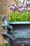 Old metallic flower pot with grape hyacinths bluebells