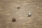 Old metallic petanque balls on fine stone field