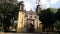 Old Mexican Church surrounded by trees in Coyoacan