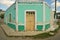 Old Mexican village of Celestun on Gulf of Mexico with old green building storefront