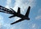 Old military plane monument on blue sky background