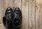 Old military shoes on wooden boards