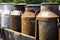 Old milk churns on a cart