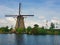 Old mill near a water canal at Kinderdijk Overwaard in the Netherlands. Windmill Unesco World Heritage with unique Dutch sight as