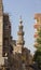 Old minaret of mosque against a bright blue sky,Islamic Cairo, Egypt