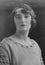 Old monochrome studio photograph of a pretty Caucasian young woman dating to the 1920s, Edwardian era.