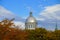 Old Montreal, Canada - October 25, 2019 - The view of the exterior dome of Bonsecours Market surrounded by striking colors of fall