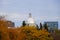 Old Montreal, Canada - October 25, 2019 - The view of the exterior dome of Bonsecours Market surrounded by striking colors of fall