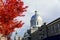 Old Montreal, Canada - October 25, 2019 - The view of the exterior dome of Bonsecours Market surrounded by striking red colors of