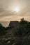 Old monumental castle ruin with sea view and beautiful orange sky in Puglia, Italy