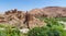 Old Moroccan clay kasbah perched on hill in Atlas mountains, Morocco, North Africa