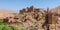 Old Moroccan clay kasbah perched on hill in Atlas mountains, Morocco, North Africa