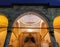 Old mosque entrance and decorations above with stone pillars in turkish architecture islamic building style