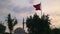 Old mosque which named Bey Cami and waving Turkish flag in Aydin Turkey