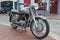 Old motorcycle parked on a pavement / sidewalk in Le Touquet