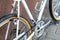 Old mountain bike against the wall. Repair of retro bicycles. Bicycle as a means of preserving health. Fashionable bicycle for