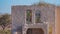 Old mud building with iron colored doors