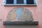 The old mural on the facade of the house shows the peacock in Zurich