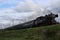 Old museum steam locomotive train at railroad track between Gouda and Rotterdam