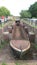 Old narrow boat shell in disused canal lock chamber