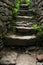 Old narrow stone stairs with brick wall. Explore concept