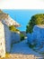 Old narrow stone street and stairs with seascape in background in Portovenere  town. Lord Byron Park and Doria castle on Ligurian