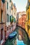 The old narrow street with a boat in Venice