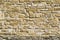 Old natural stone wall, background, texture or pattern. Rustic texture. Wall with bricks of italian stones