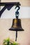 Old naval brass bell. Nautical copper ship bell with rope.