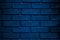 Old navy blue brick wall interior.