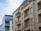 Old and New Apartment Buildings with Blue Sky