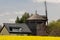 Old and new, a contrast seen - windmill and solar panels on the roof