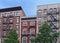 Old New York apartment building with external fire escapes,