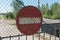 Old no entry for vehicular traffic road sign on rusty fence. Forbidden road or street sign