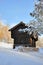 Old norwegian house surrounded by snow