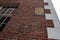 Old Nuclear Fallout sign seen attached to an old Bank in Salem, MA.