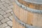 Old oak barrel closeup used as a table at a street fair on a blurred background city square