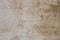 Old obsolete beige plastered wall background texture