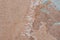 Old obsolete brown plastered wall background texture