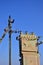 Old and obsolete electrical transformer against the background of a cloudless blue sky. Device for distribution of supply of high