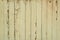 Old obsolete yellow painted planks wall background texture