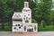 Old, old Russian stove. White and stone with drawings and paintings of ornaments