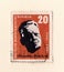 An old orange east german stamp with an image of Hermann Abendroth the famous conductor