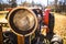 Old orange farm tractor headlight