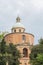 Old orange temple with cloudy sky as background In Italy